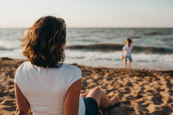 single mum with child playing