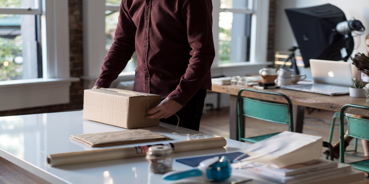 a person packing home and office items